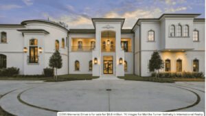 Front view of Houston luxury mansion with rooftop lounge and 26 foot ceilings